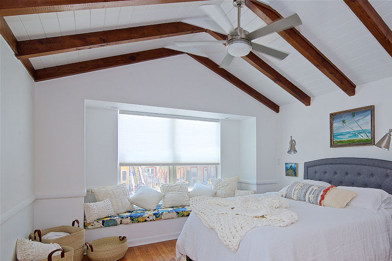 A bright bohemian coastal design in this midcentury modern bedroom by Denver based interior designer Fernway & Avalon.