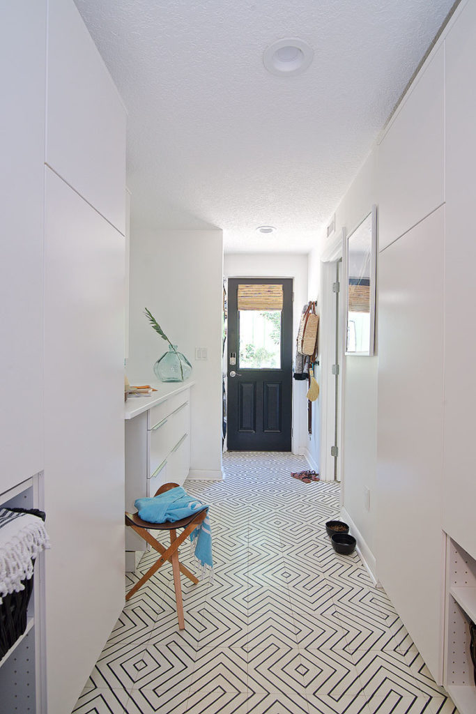 A clean modern white mud room / pantry combo by Denver based interior designer Fernway & Avalon.
